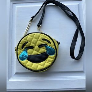 Girl bag laughing emoji.